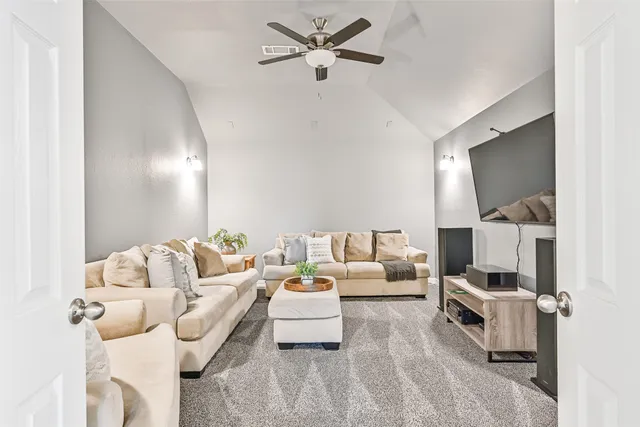 a view of a lake with couches chairs and city view