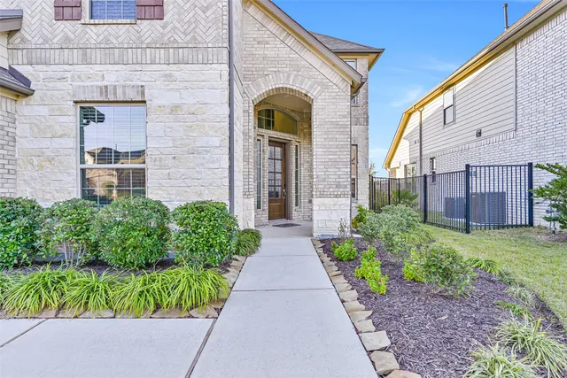 a view of a dining room with furniture wooden floor and chandelier