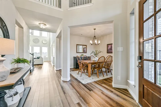 a living room with furniture a fireplace and a large window