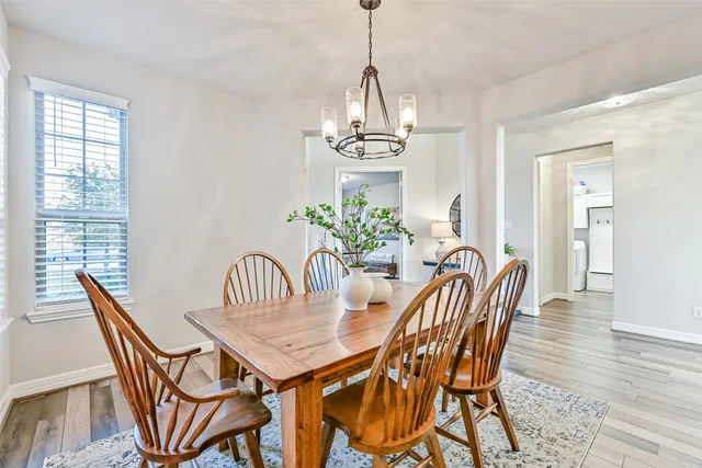a large kitchen with lots of counter space a sink appliances and cabinets