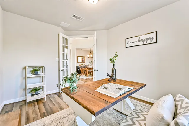 a dining room with furniture window wooden floor