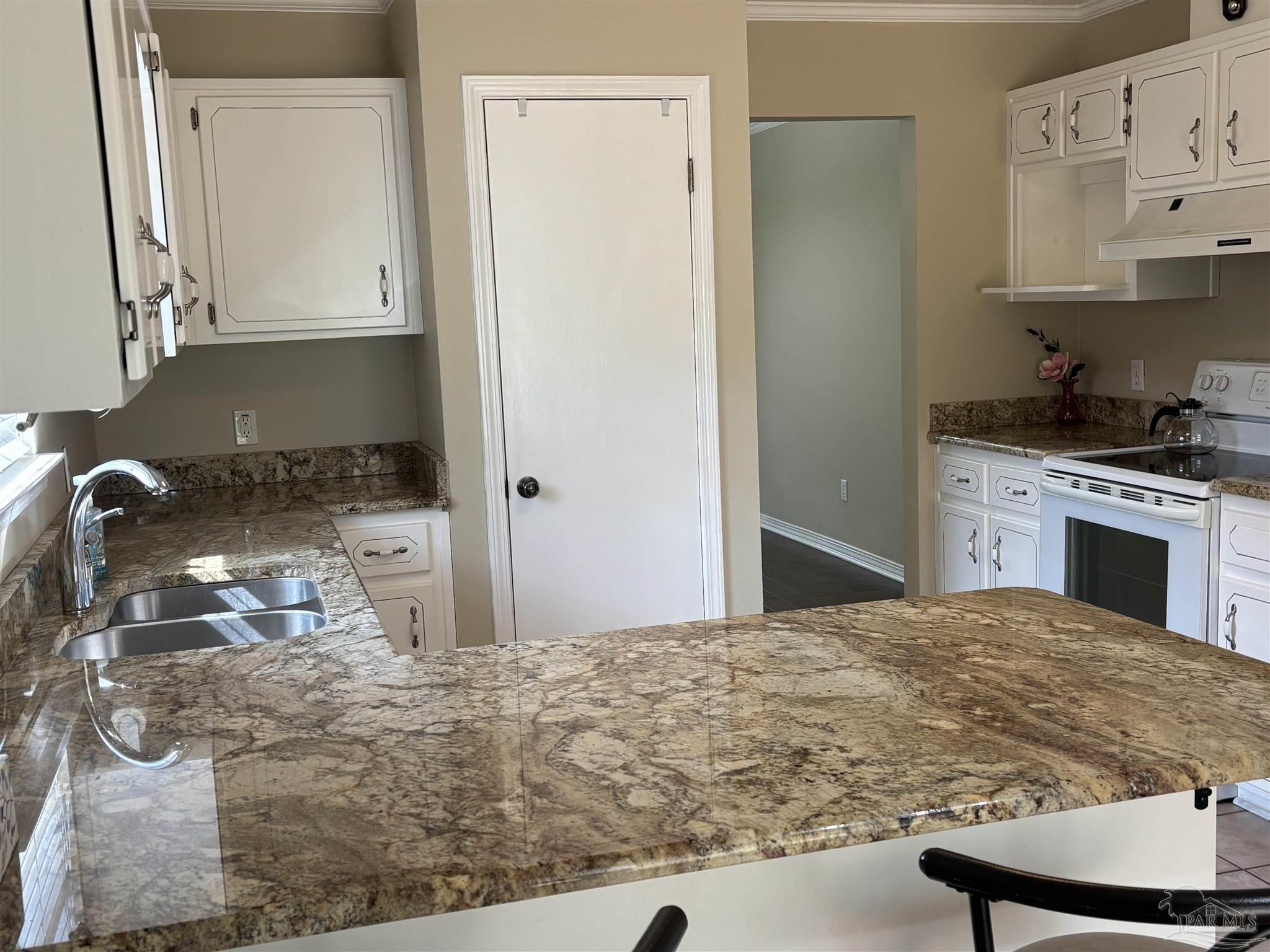 5309 Gillette Way Milton, FL 32570 - Photo 11 of 51 a kitchen with granite countertop a sink stainless steel appliances and cabinets