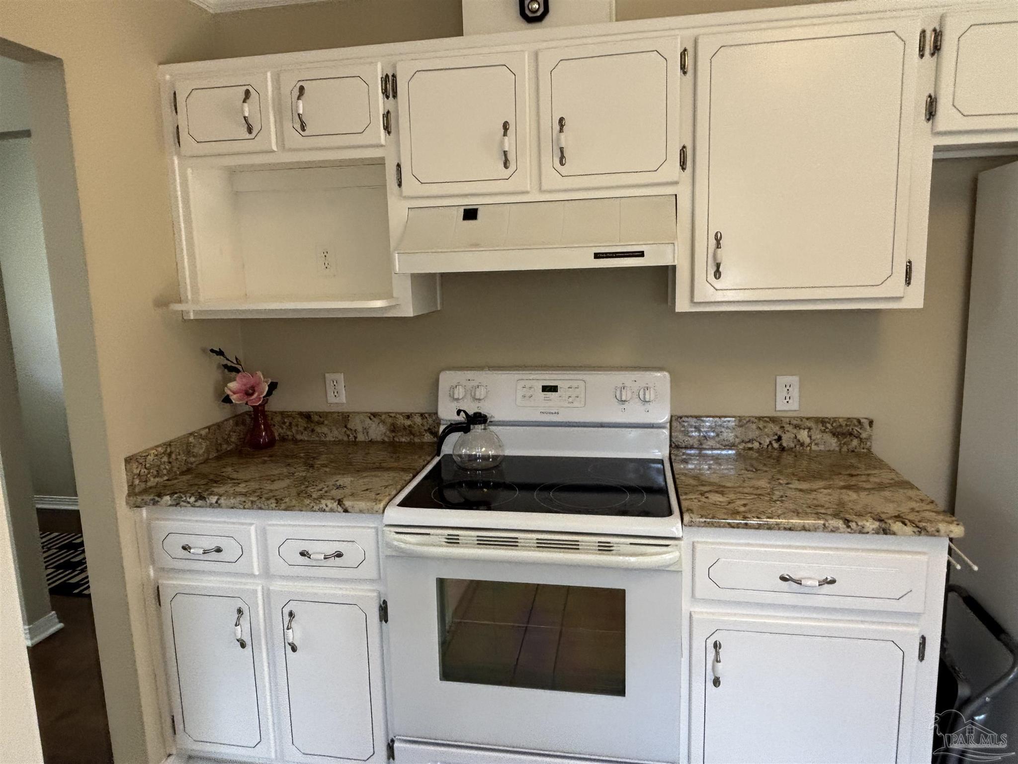 5309 Gillette Way Milton, FL 32570 - Photo 12 of 51 a kitchen with white cabinets and white appliances