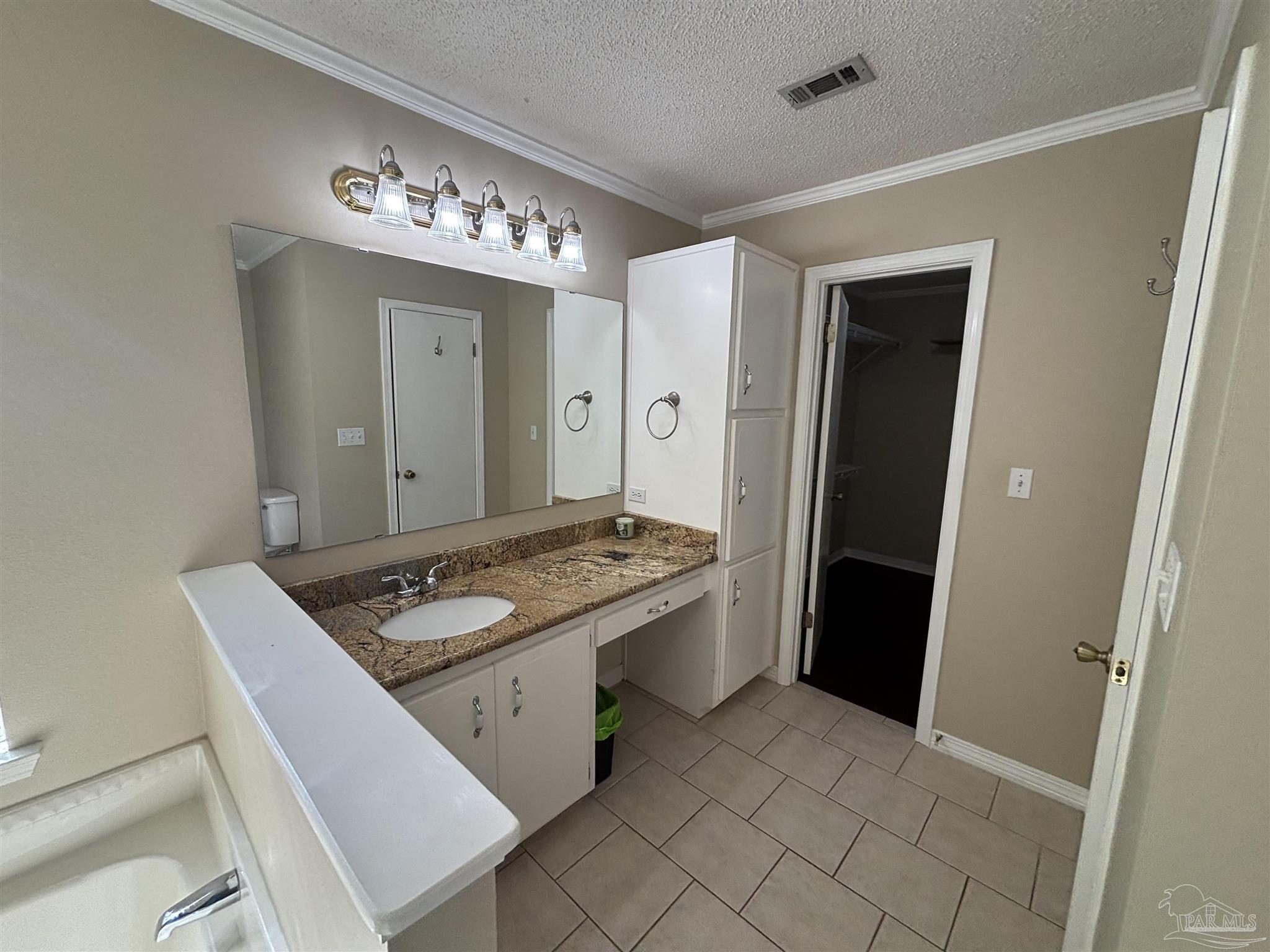 5309 Gillette Way Milton, FL 32570 - Photo 17 of 51 a kitchen with a sink stove and refrigerator