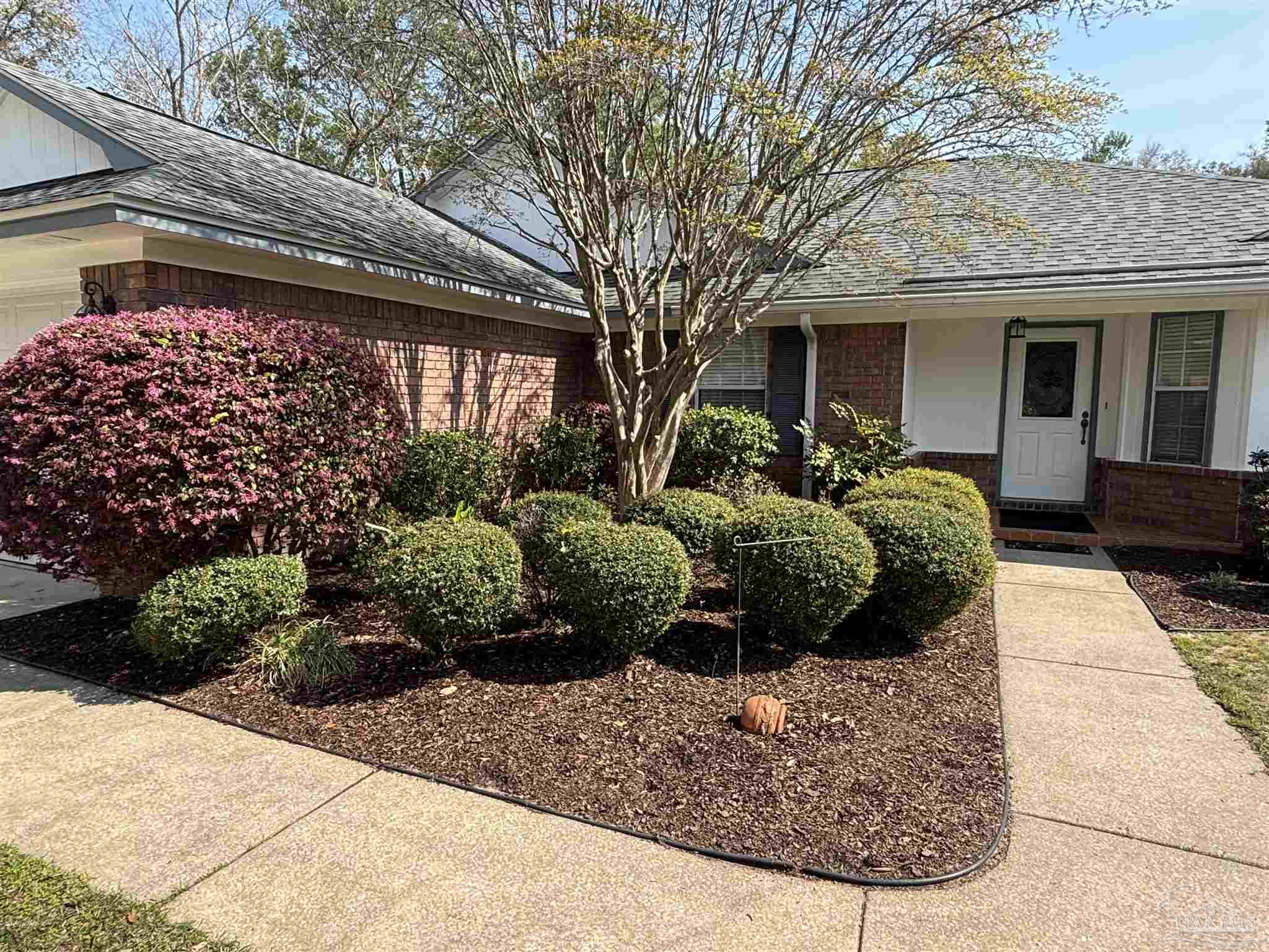 5309 Gillette Way Milton, FL 32570 - Photo 2 of 51 a view of a house with a flower garden