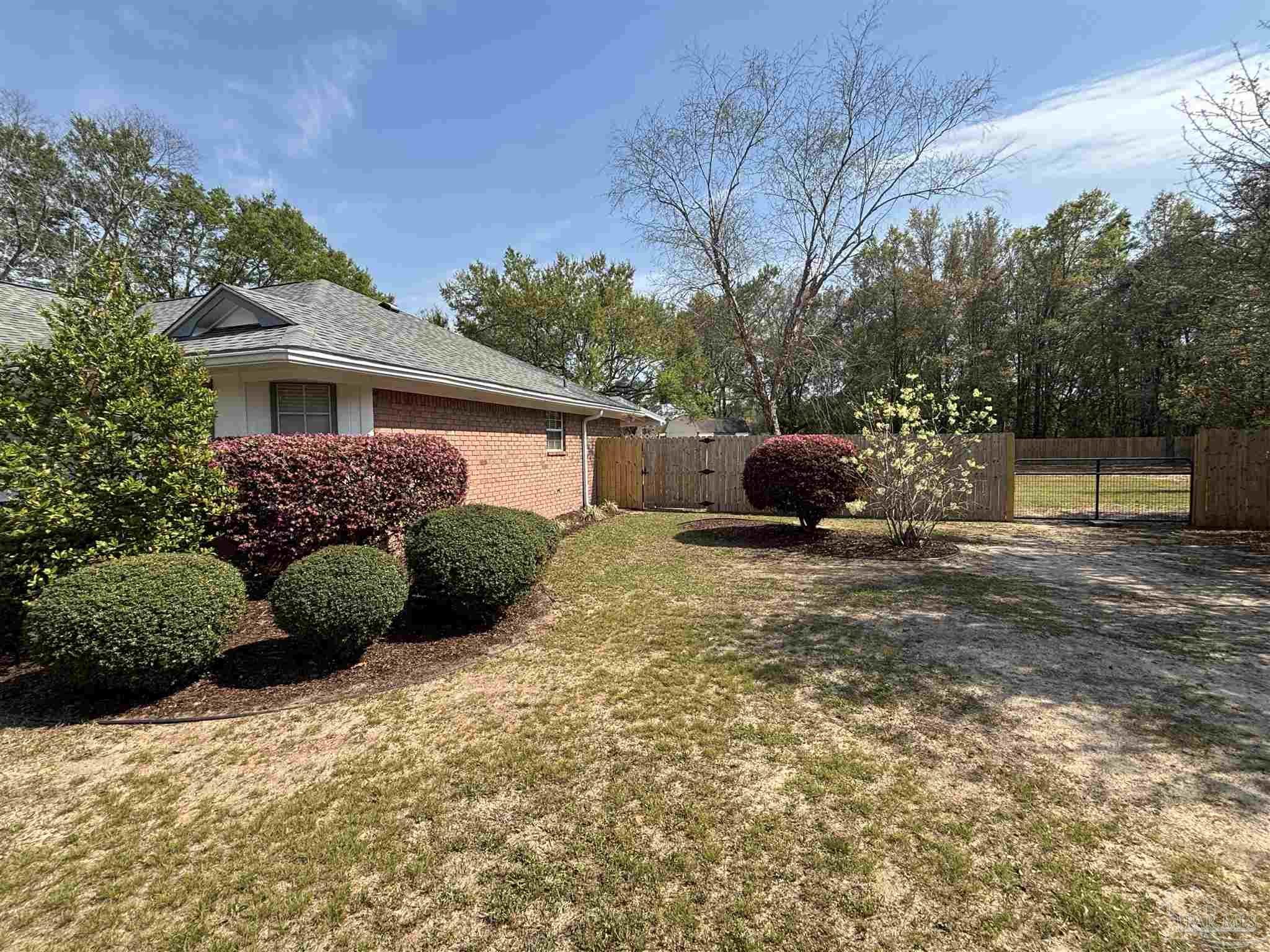 5309 Gillette Way Milton, FL 32570 - Photo 32 of 51 a front view of a house with a yard