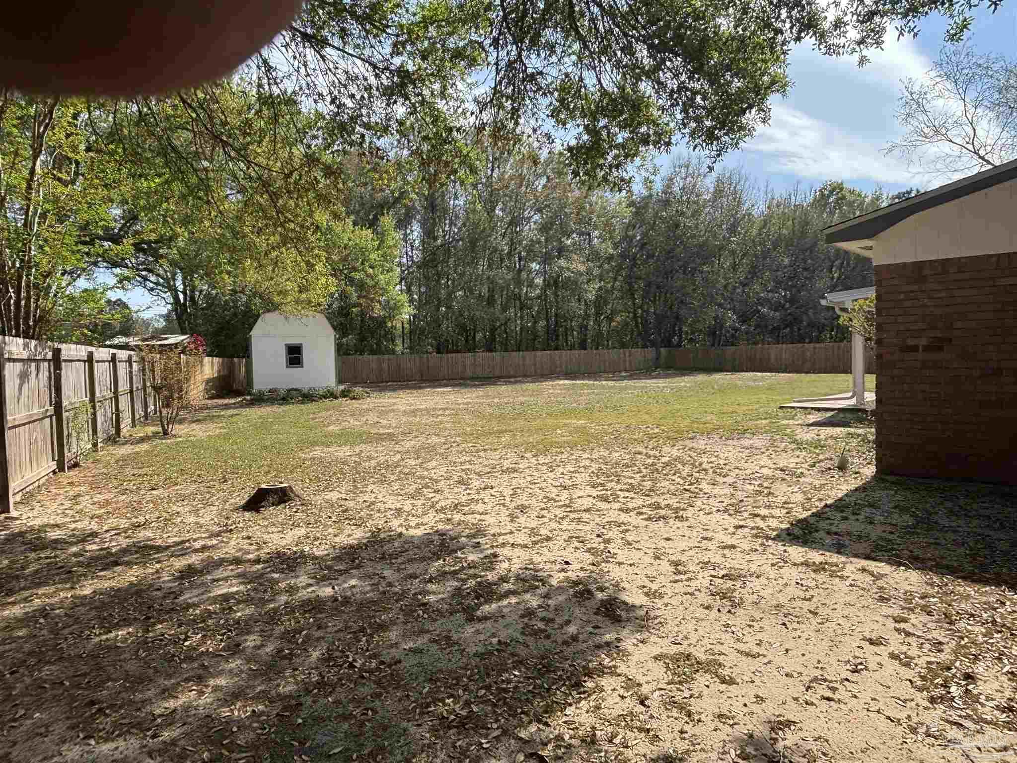 5309 Gillette Way Milton, FL 32570 - Photo 35 of 51 a view of a house with backyard and tree