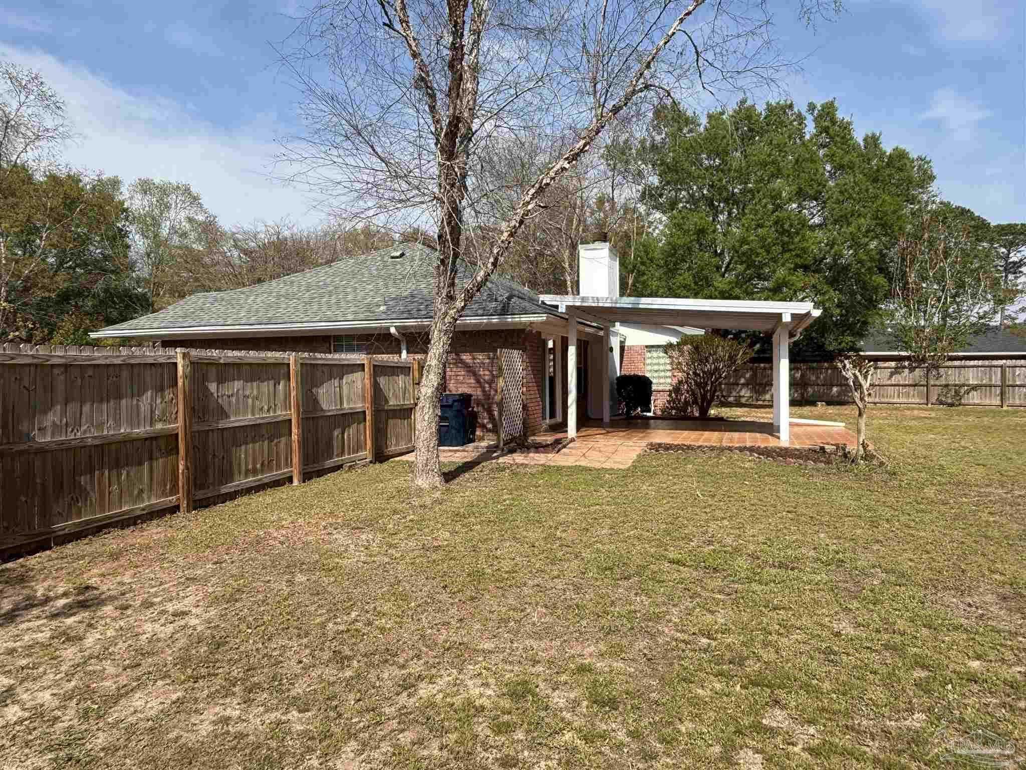 5309 Gillette Way Milton, FL 32570 - Photo 38 of 51 front view of a house with a large tree