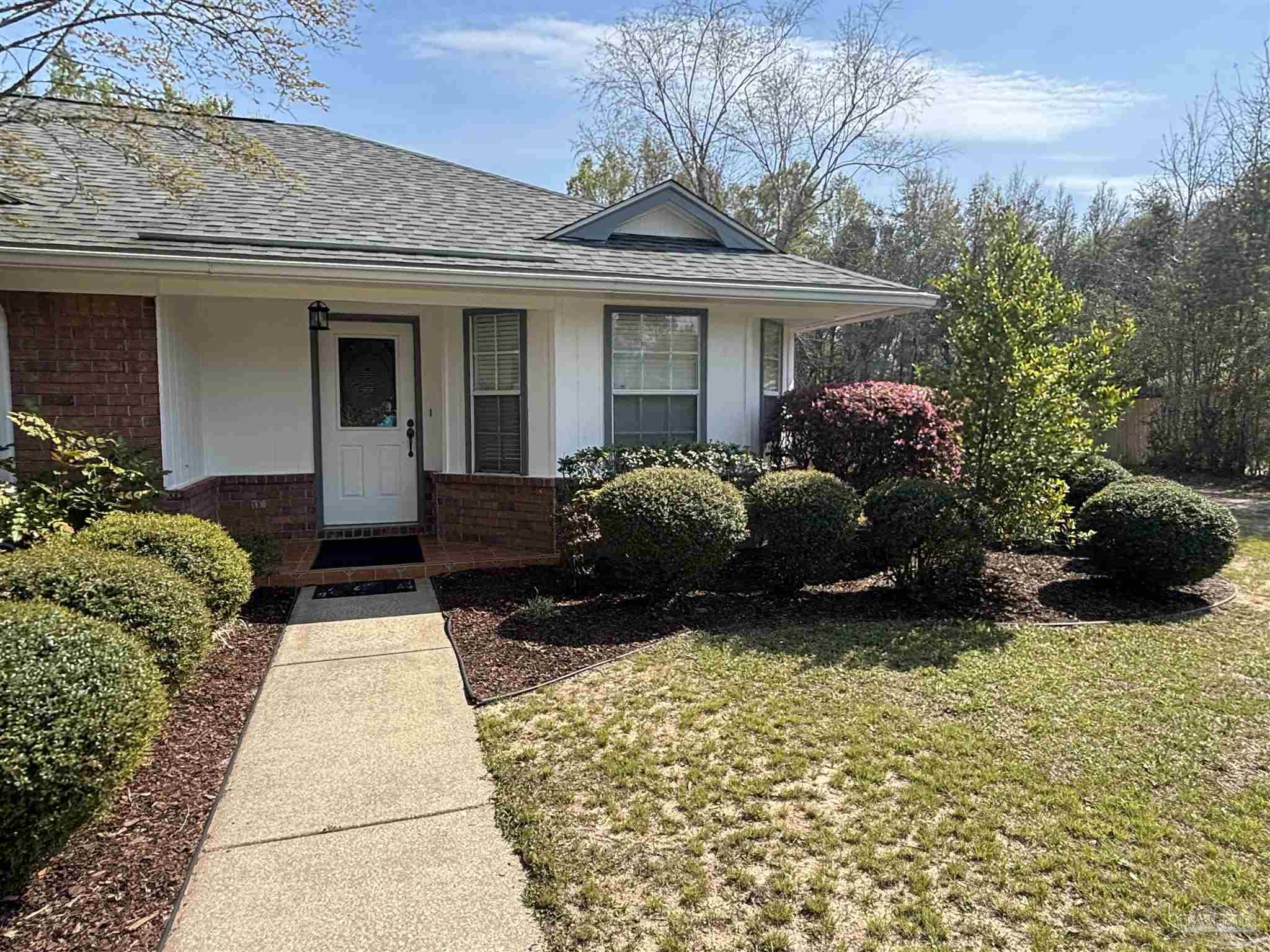 5309 Gillette Way Milton, FL 32570 - Photo 4 of 51 a house view with a garden space