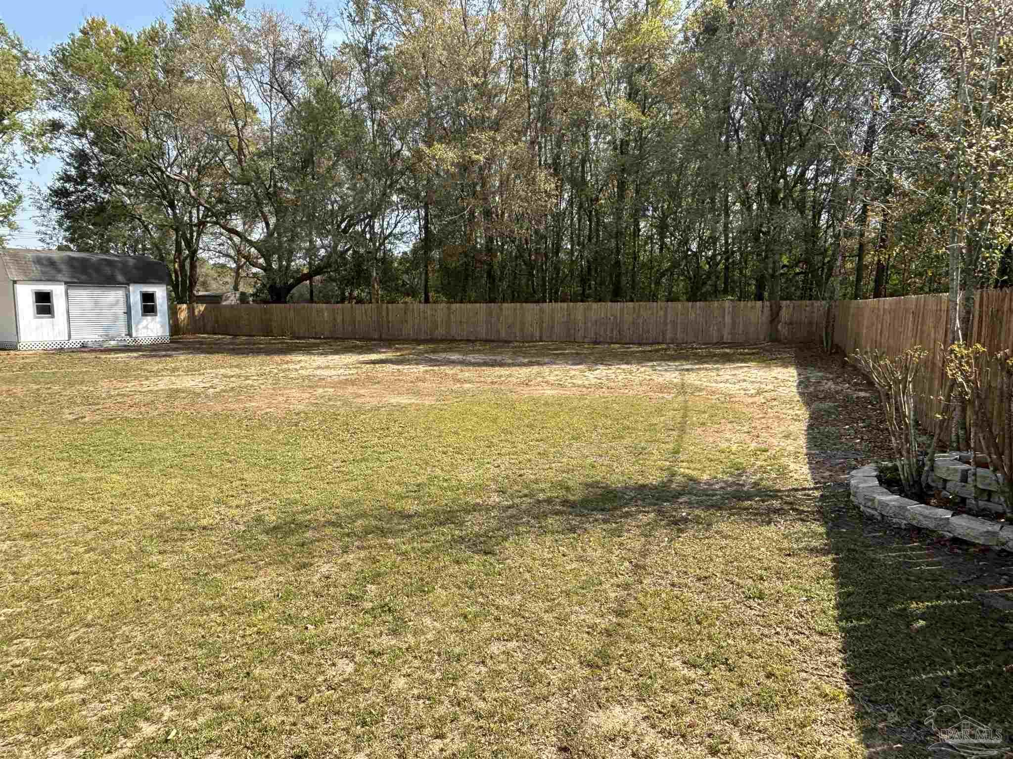 5309 Gillette Way Milton, FL 32570 - Photo 43 of 51 a view of a swimming pool and a yard