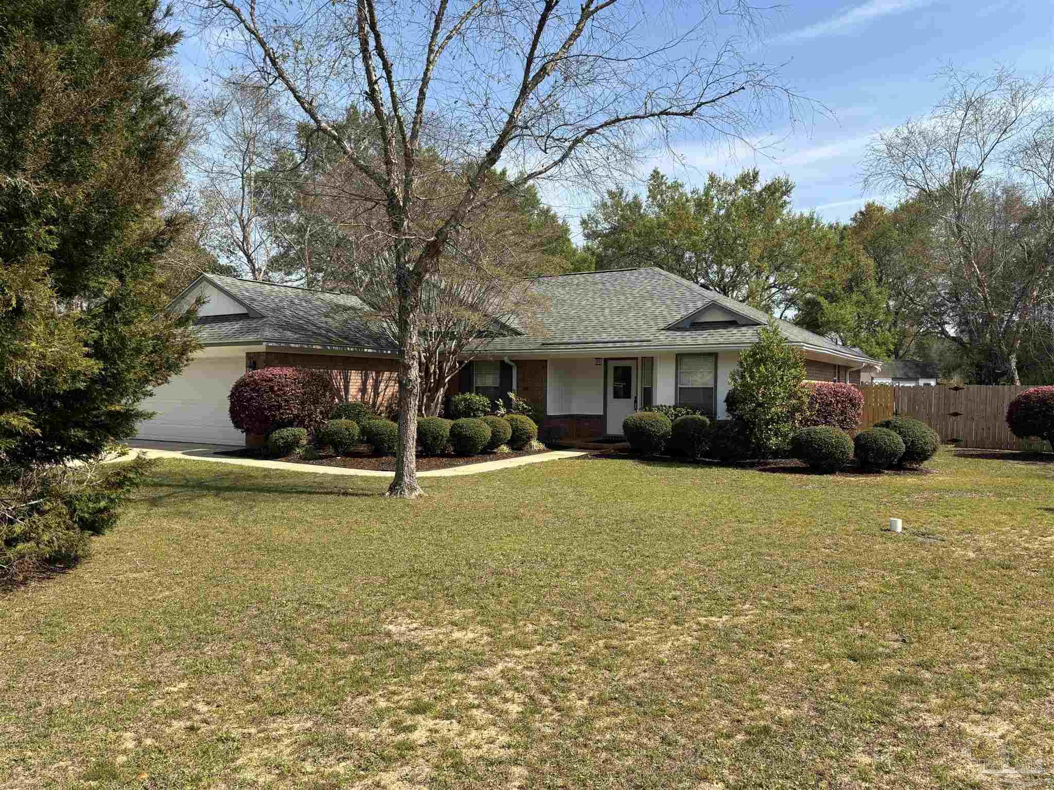 5309 Gillette Way Milton, FL 32570 - Photo 51 of 51 a front view of a house with garden