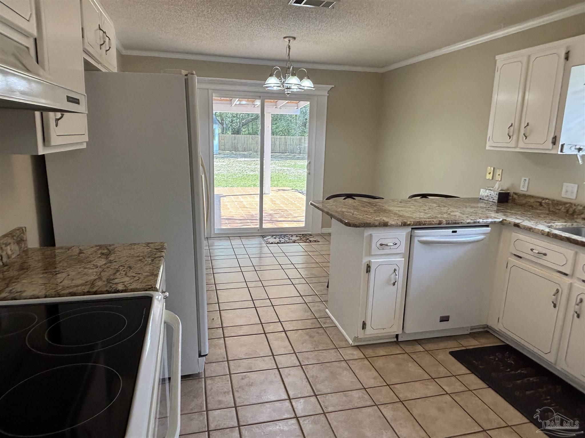 5309 Gillette Way Milton, FL 32570 - Photo 9 of 51 a kitchen with a stove and a sink