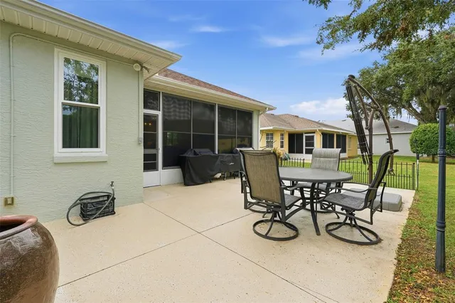 a view of a dinning table and chairs in patio
