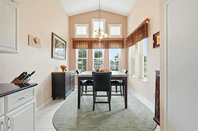 a dining room with furniture and window