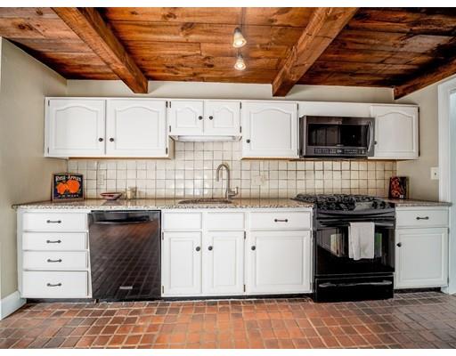 93 Edmands Road Framingham, MA 01701 - Photo 5 of 25 a kitchen with cabinets appliances and a wooden floor
