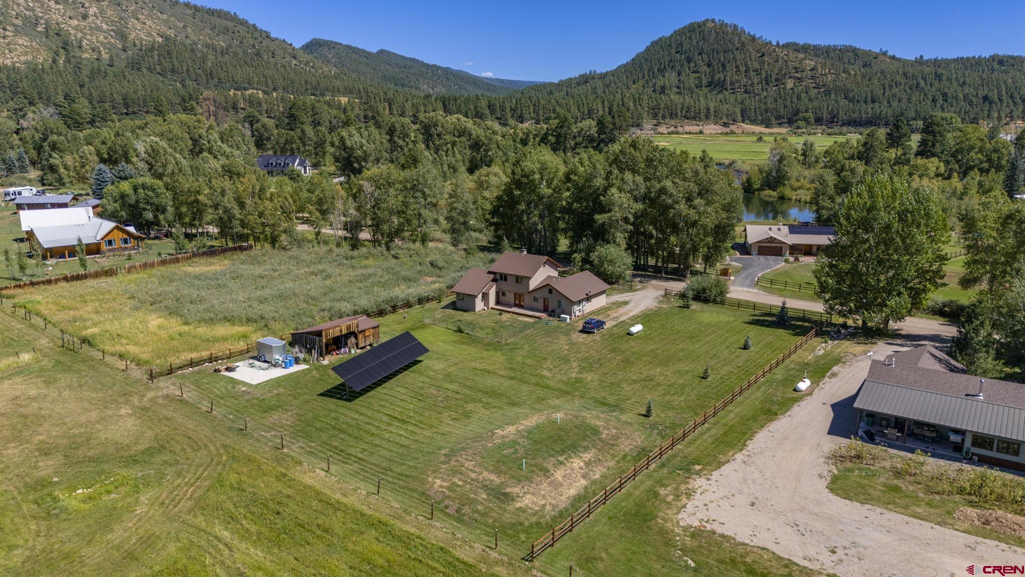 a view of a golf course with chairs
