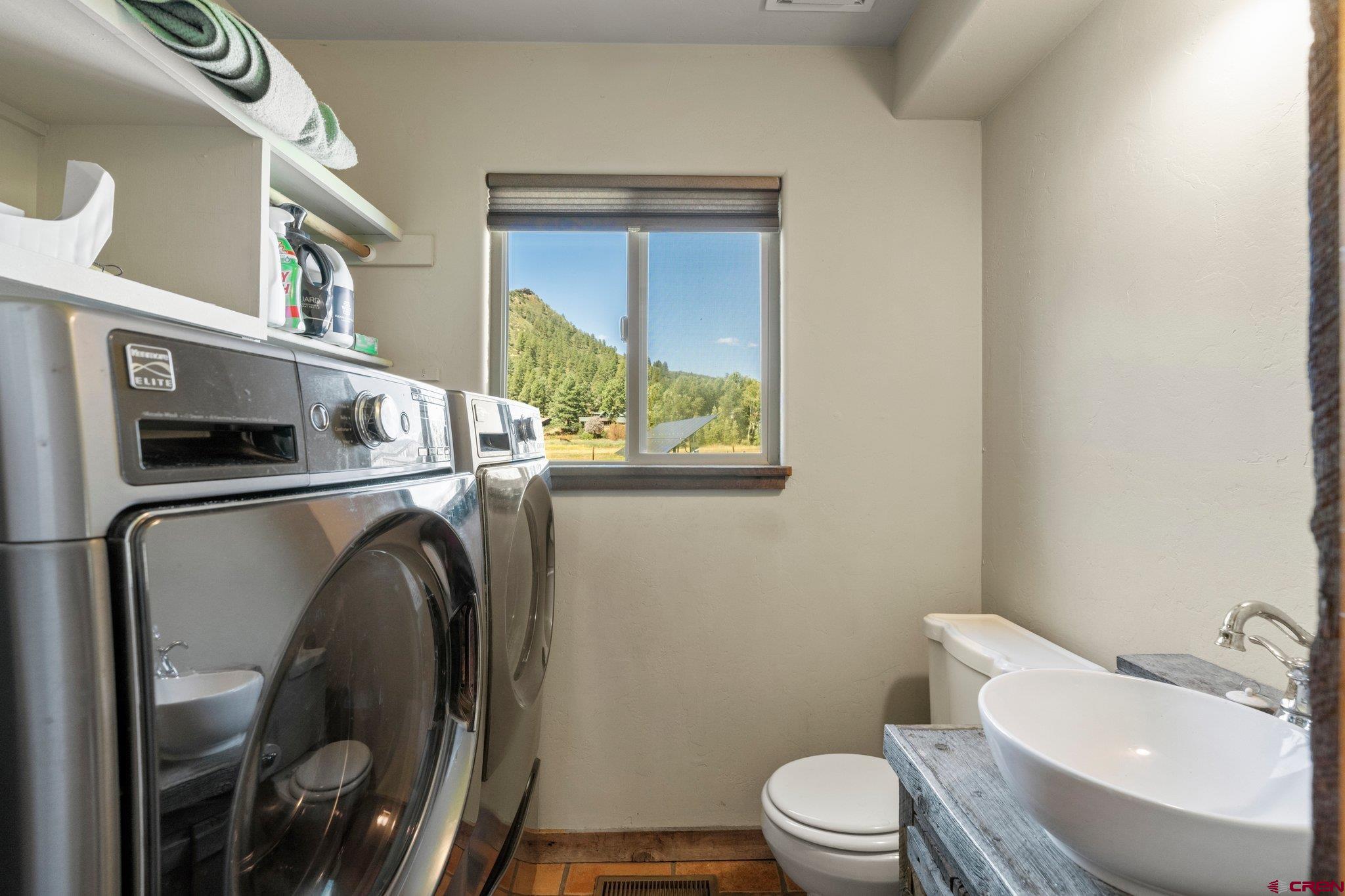 115 Pine River Ranch Circle Bayfield, CO 81122 - Photo 16 of 30 a utility room with dryer and washer
