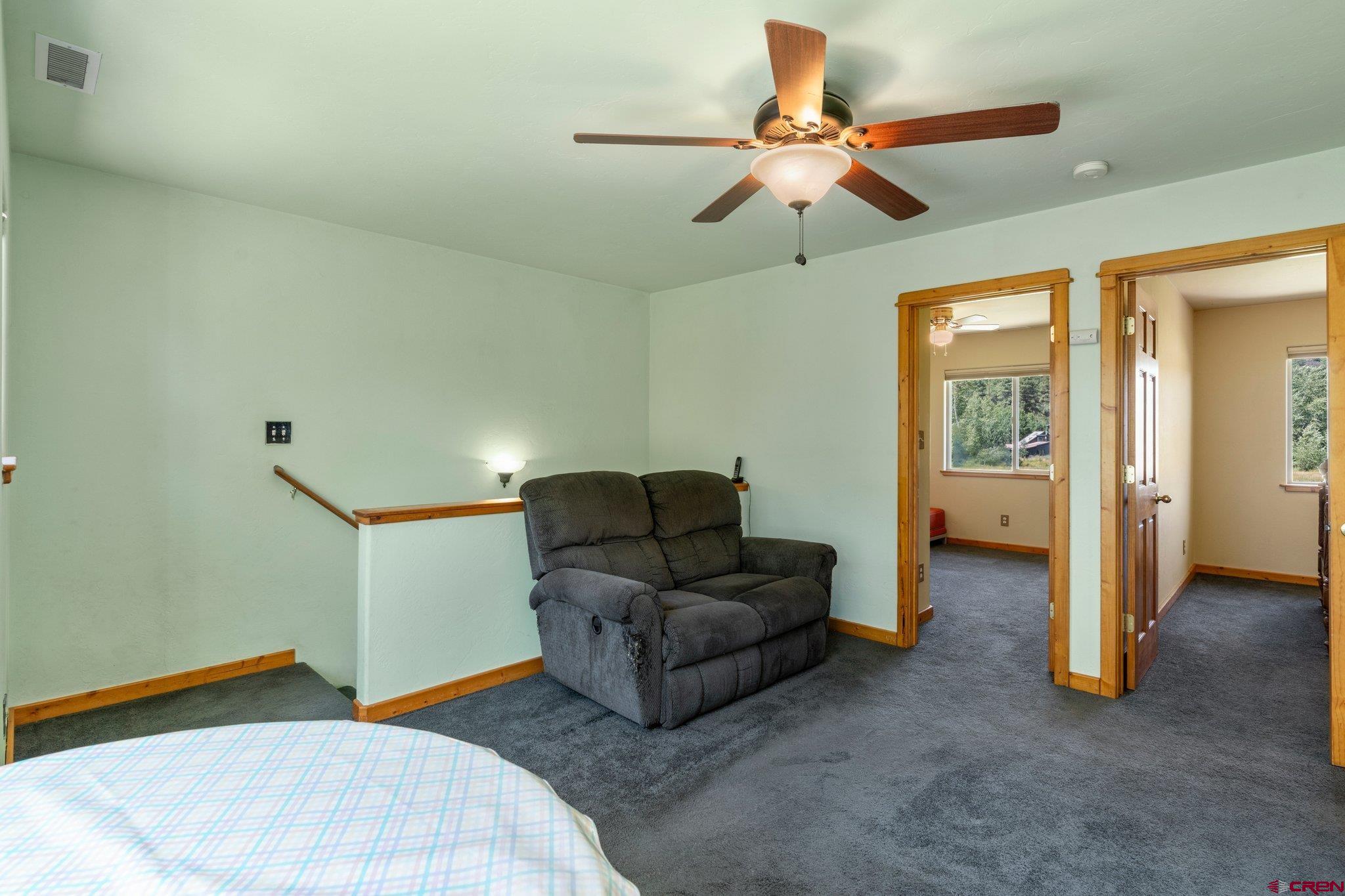 115 Pine River Ranch Circle Bayfield, CO 81122 - Photo 17 of 30 a living room with furniture and a ceiling fan