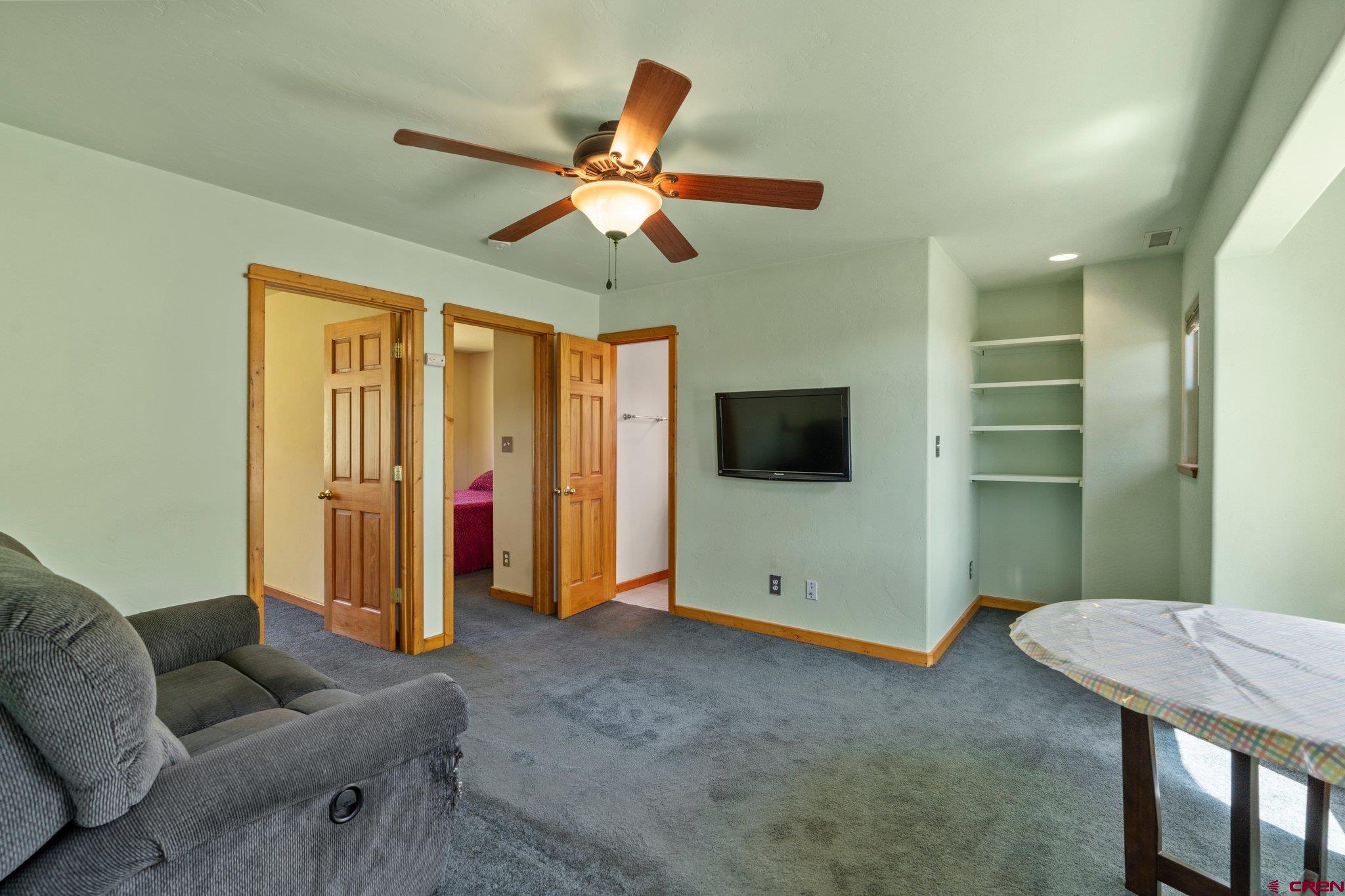 115 Pine River Ranch Circle Bayfield, CO 81122 - Photo 18 of 30 a living room with furniture and a flat screen tv