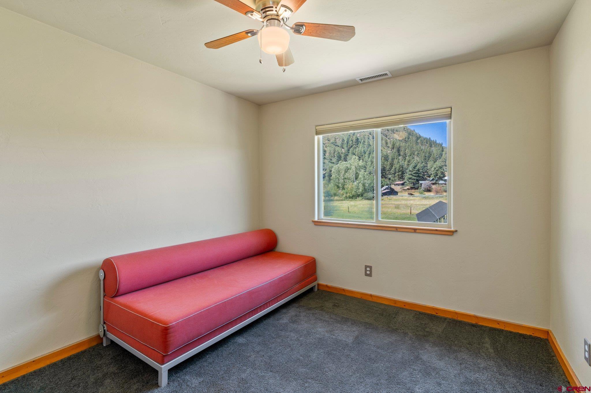 115 Pine River Ranch Circle Bayfield, CO 81122 - Photo 20 of 30 a view of room with window and a ceiling fan