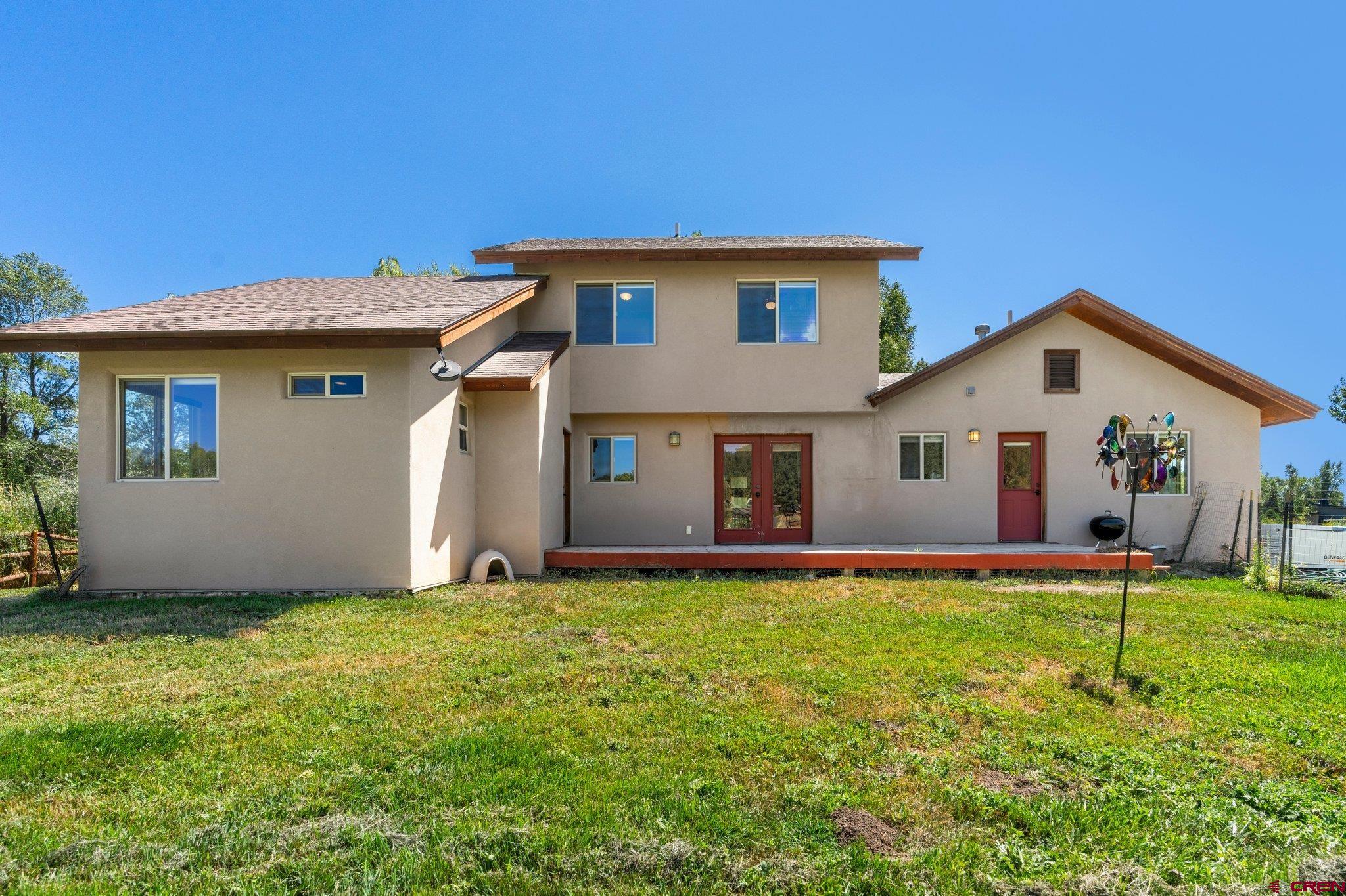 115 Pine River Ranch Circle Bayfield, CO 81122 - Photo 24 of 30 a front view of house with yard and garage