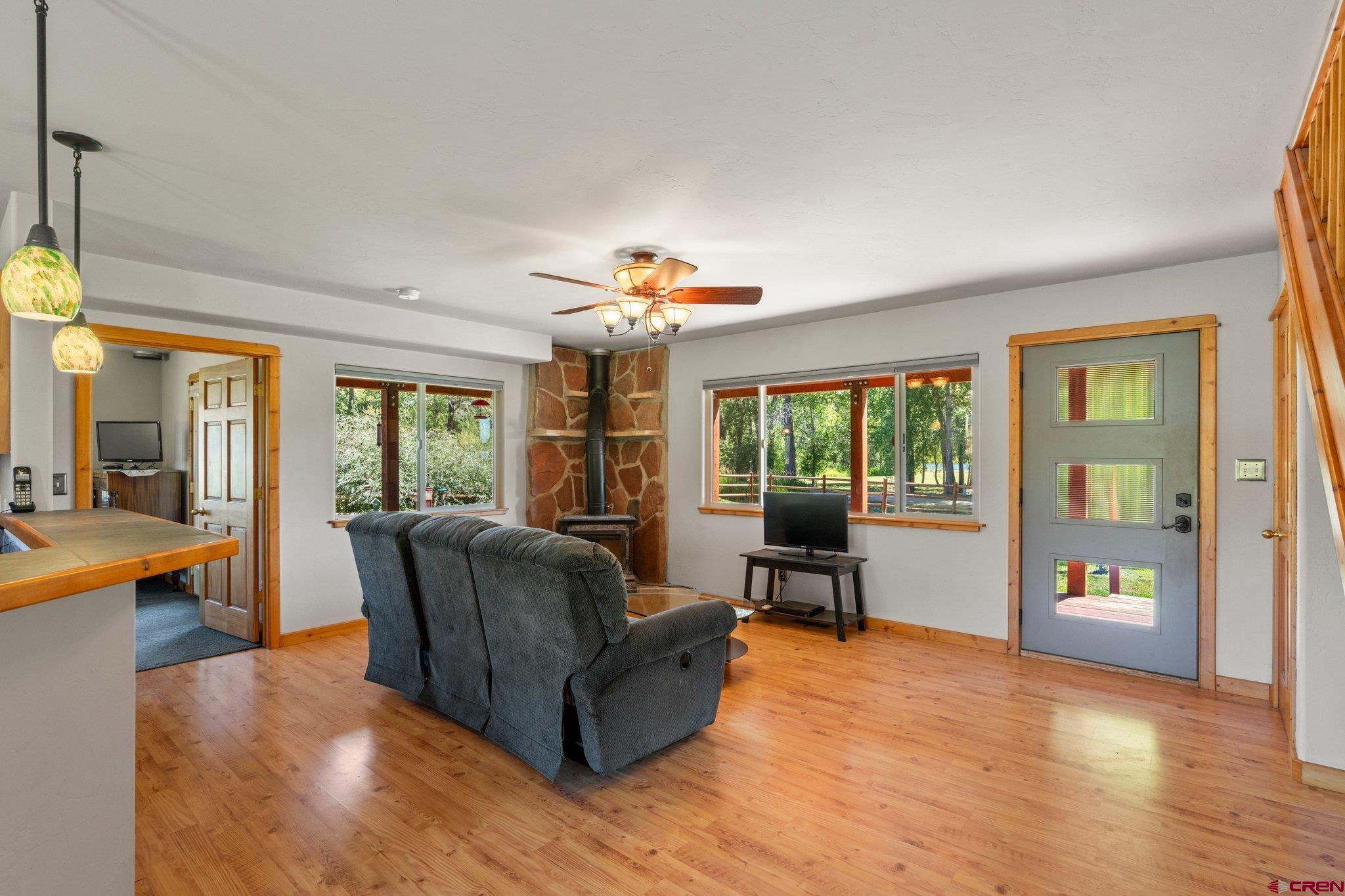 115 Pine River Ranch Circle Bayfield, CO 81122 - Photo 5 of 30 a living room with furniture and large windows