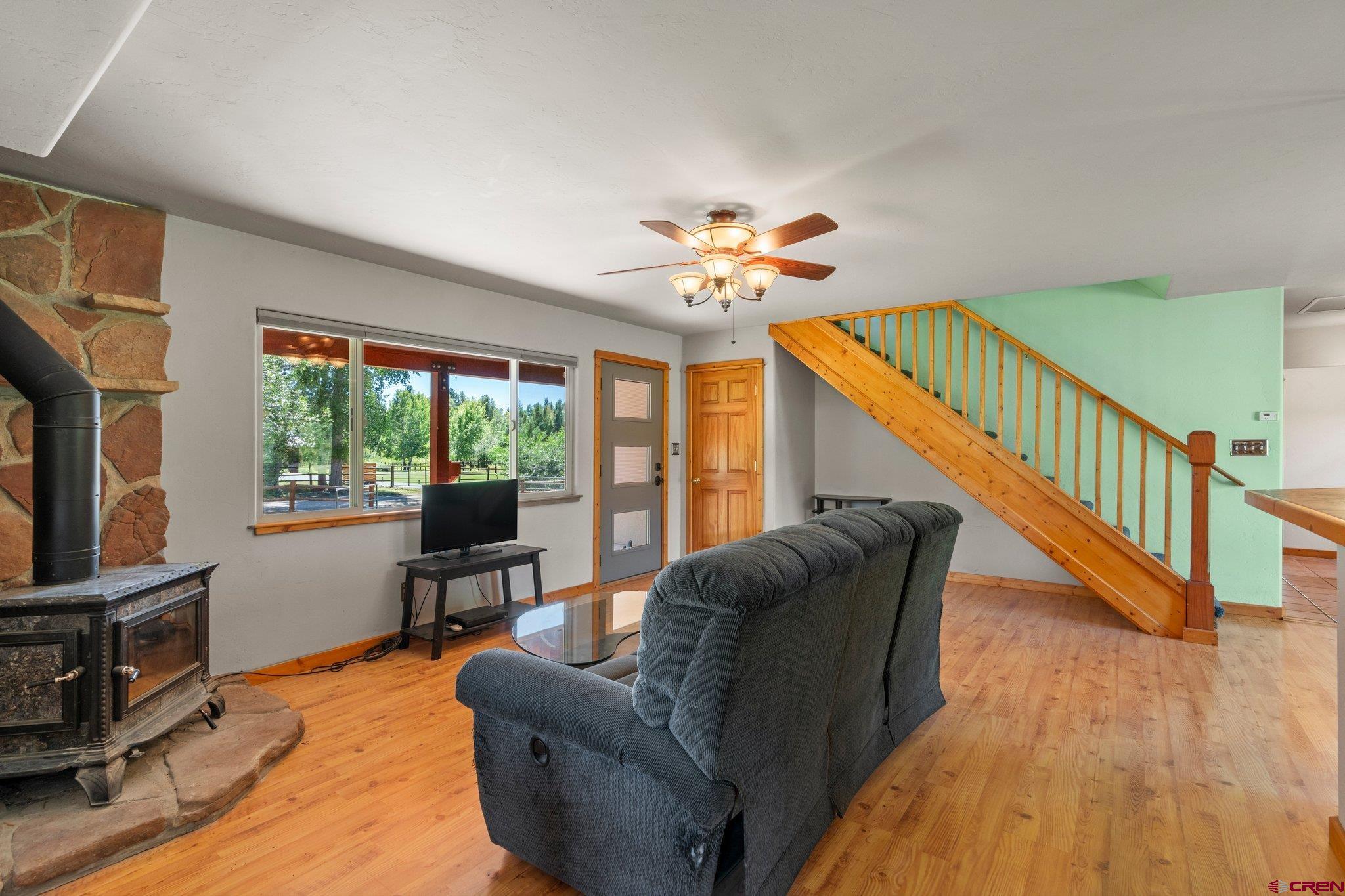115 Pine River Ranch Circle Bayfield, CO 81122 - Photo 7 of 30 a living room with furniture and a wooden floor