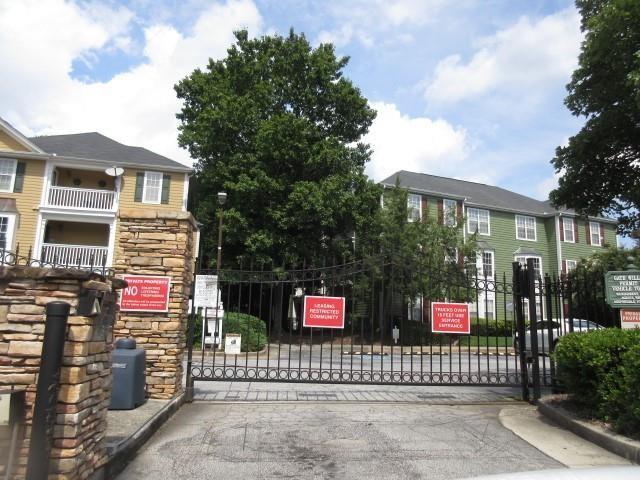 225 Bentley Place Tucker, GA 30084 - Photo 2 of 18 a view of sign board with a small yard