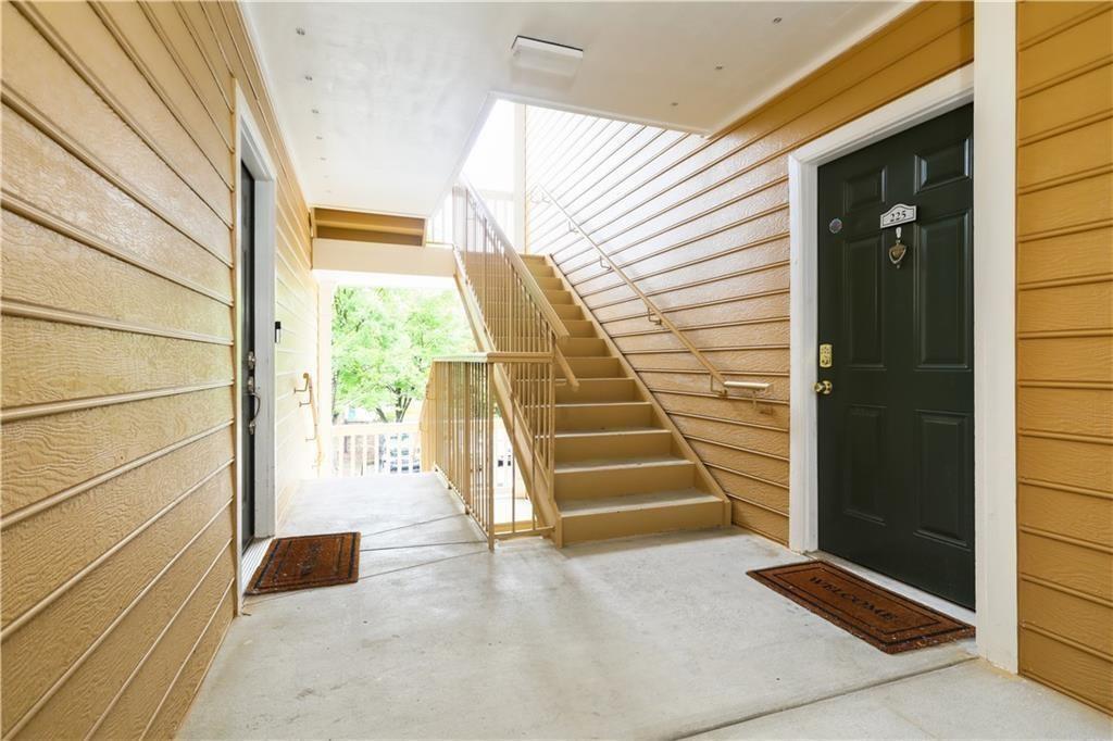 225 Bentley Place Tucker, GA 30084 - Photo 5 of 18 a view of entryway with wooden floor and front door