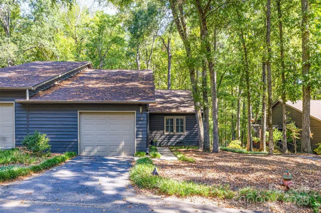 a front view of house with yard and seating area