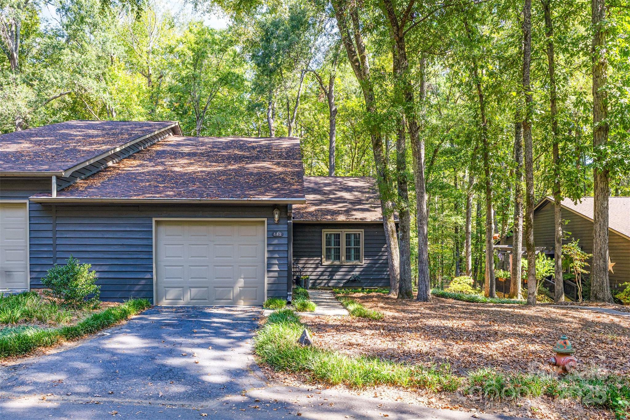 a front view of house with yard and seating area