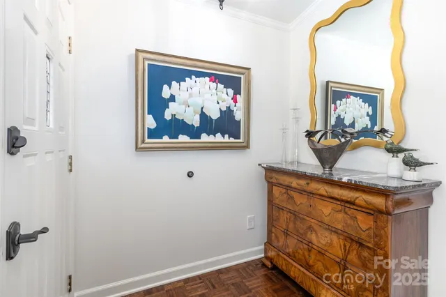 a view of a hallway with paintings on the wall