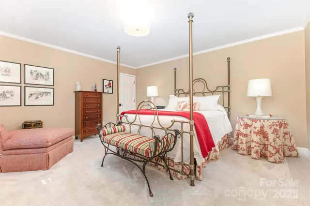 a bedroom with bed and a couch