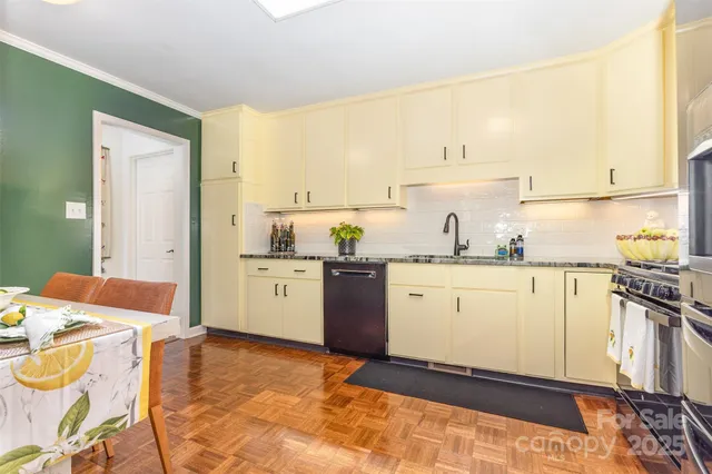 a kitchen with a sink appliances and cabinets