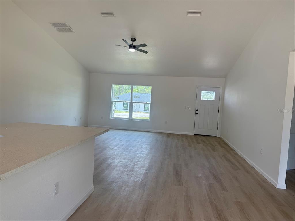 12847 Southwest 84th Terrace Road Ocala, FL 34473 - Photo 5 of 16 an empty room with windows
