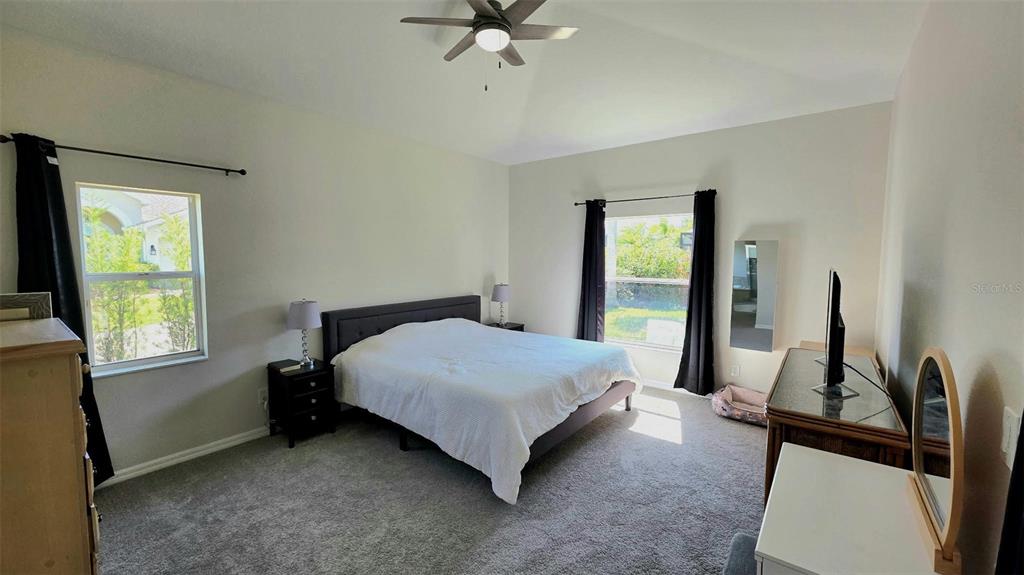 2009 Meadow Rue Court Trinity, FL 34655 - Photo 8 of 21 a bedroom with a bed and a window