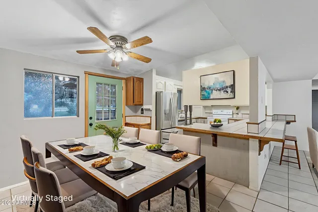 a view of a house with a yard and tree s