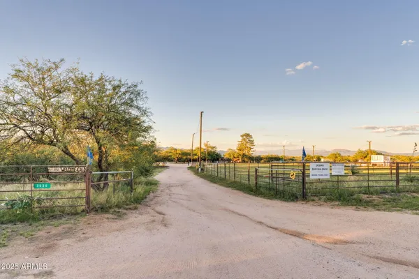 a view of a dining room with furniture and a chandelier fan