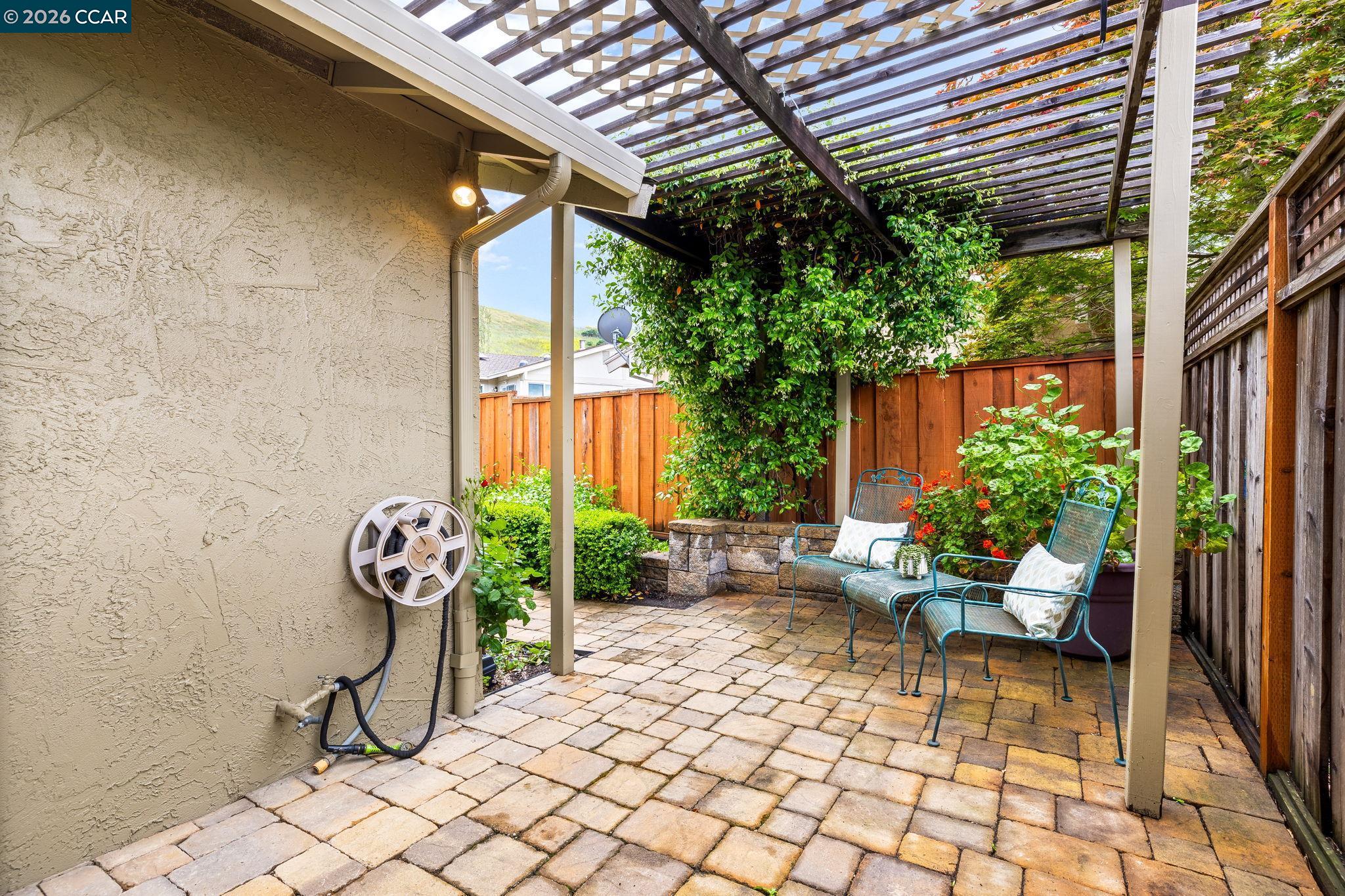 2095 Robb Road Walnut Creek, CA 94596 - Photo 18 of 26 a view of a porch with chairs and a potted plant