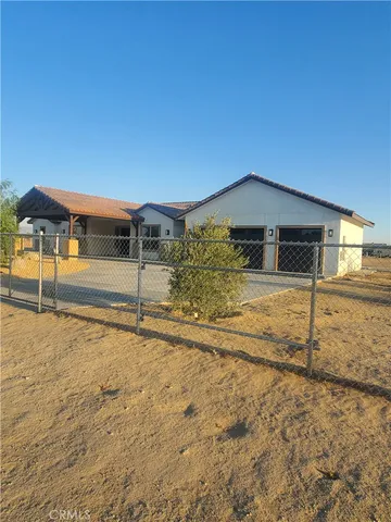 a view of a car parked in front of a house