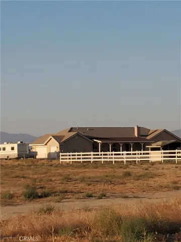 a view of a house with a ocean beach