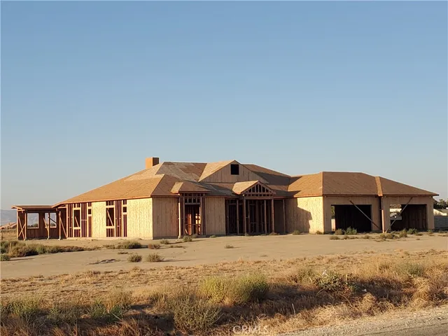 a view of swimming pool with outdoor seating and lake