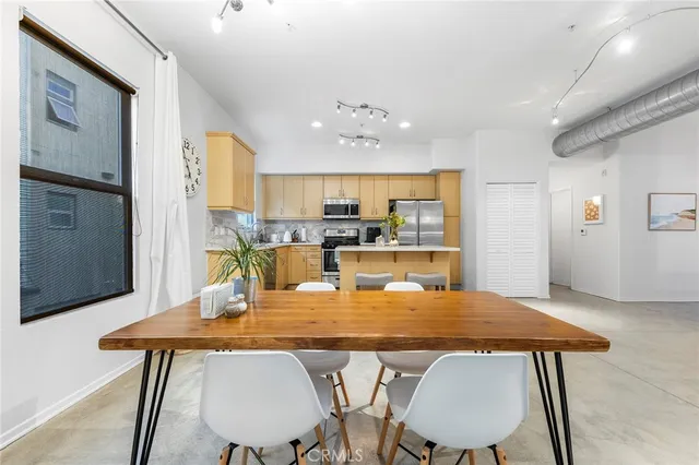 a kitchen with counter top space cabinets and stainless steel appliances