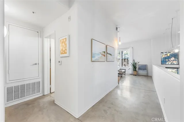 a view of a house with a backyard and a tree
