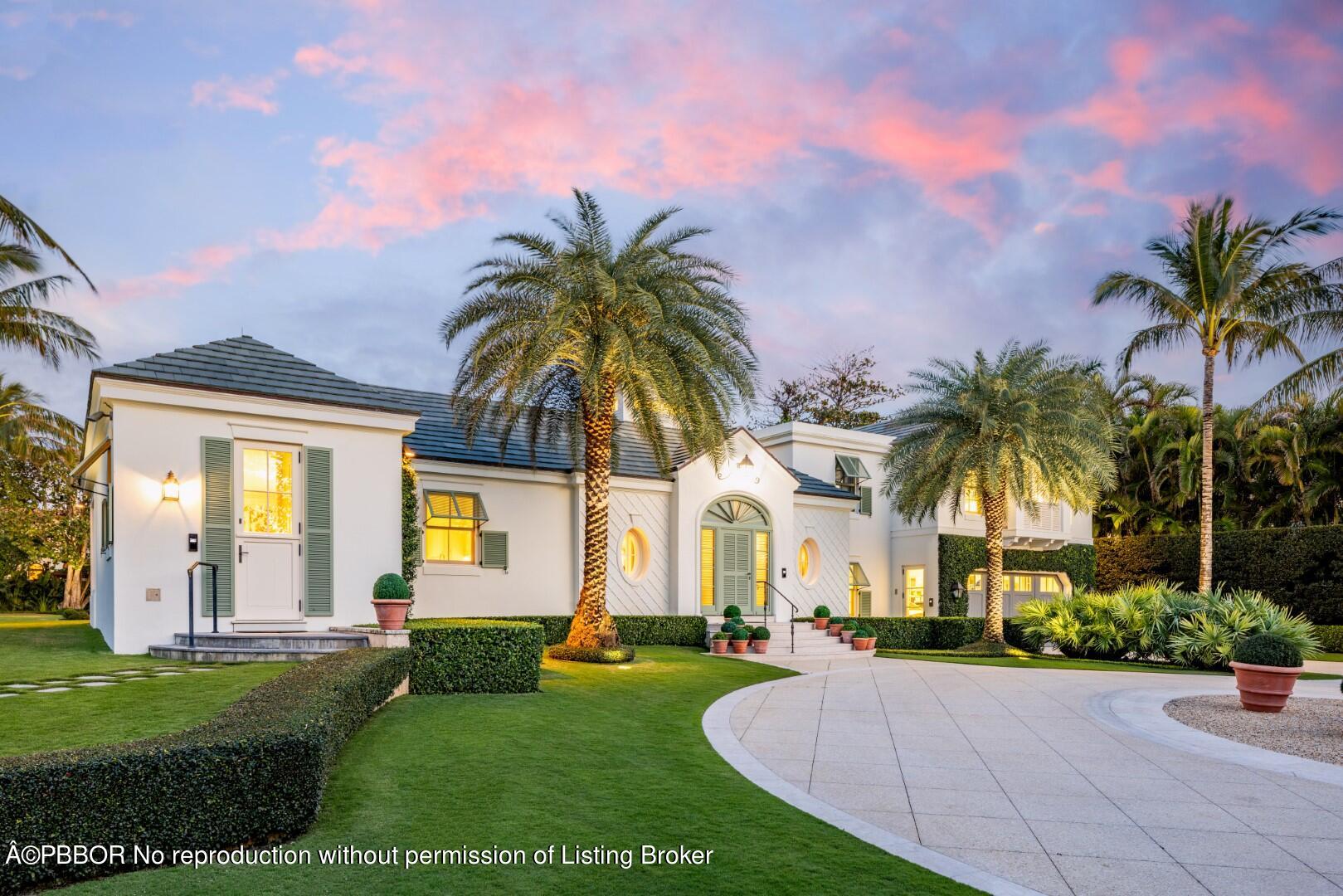 710 South County Road Palm Beach, FL 33480 - Photo 5 of 69 a view of a white house with a big yard and potted plants