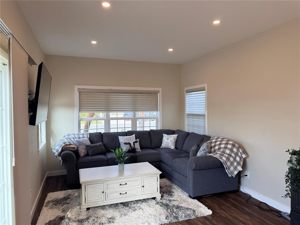 9465 Southeast 47th Way Webster, FL 33597 - Photo 12 of 32 a living room with furniture and a window