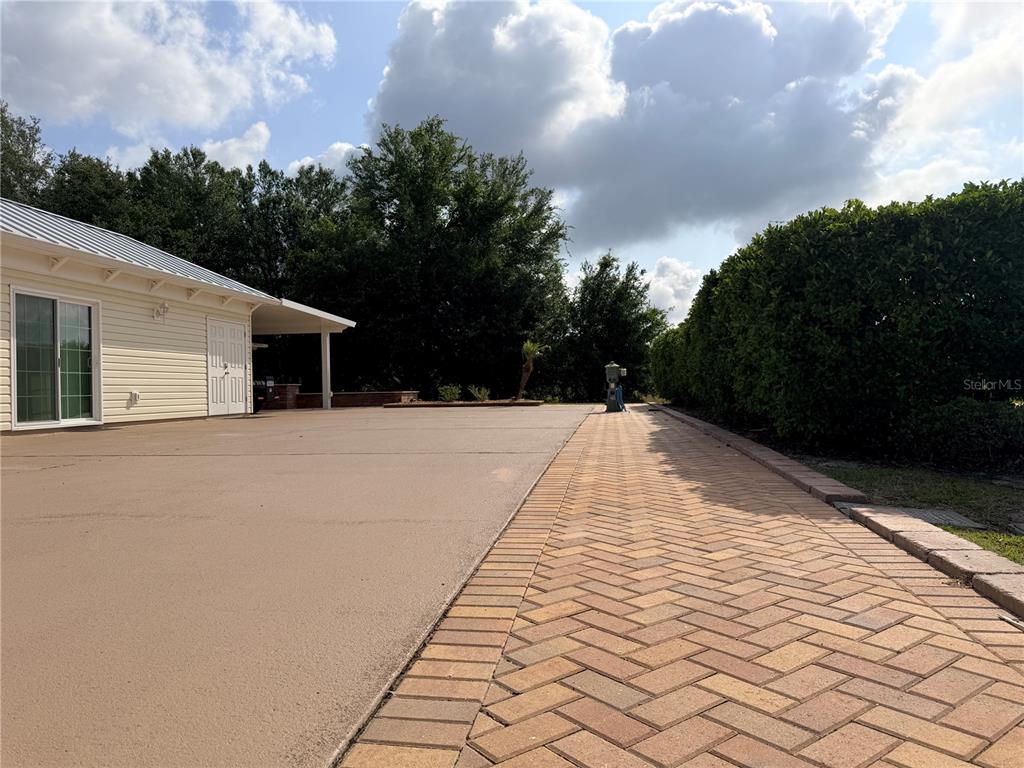 9465 Southeast 47th Way Webster, FL 33597 - Photo 3 of 32 a view of house with yard