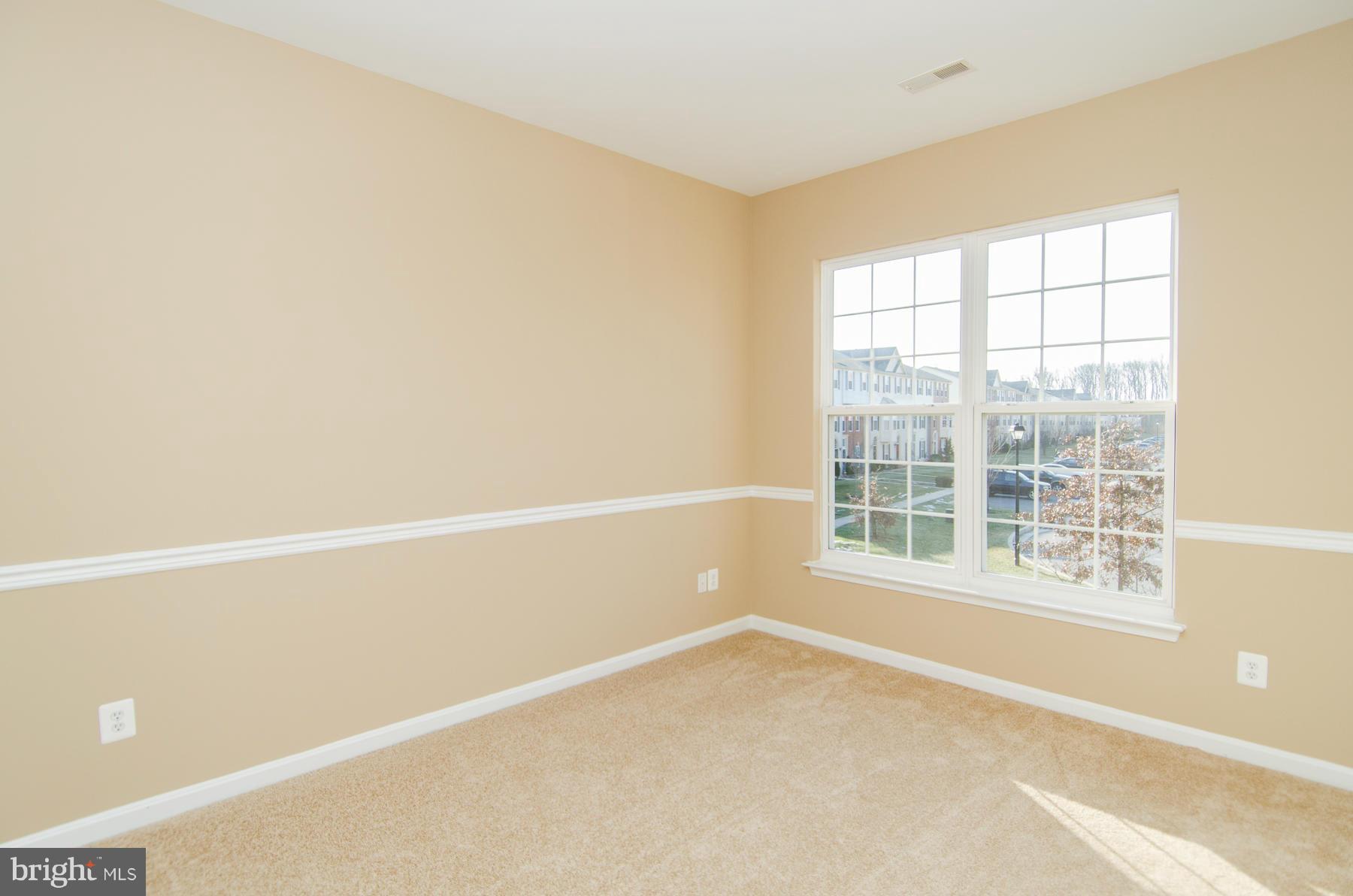4034 Cutty Sark Road Baltimore, MD 21220 - Photo 12 of 30 a view of an empty room with a window