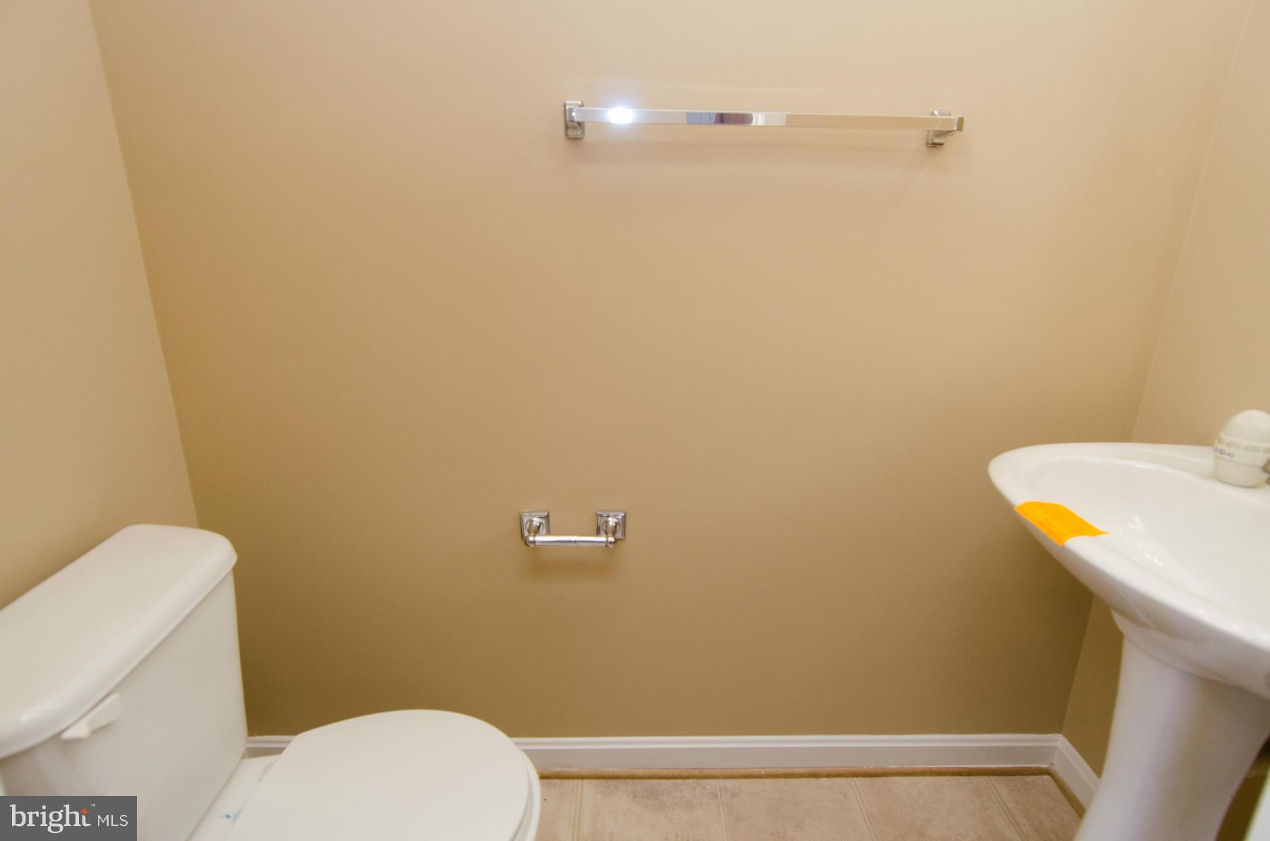 4034 Cutty Sark Road Baltimore, MD 21220 - Photo 5 of 30 a bathroom with a sink and a toilet