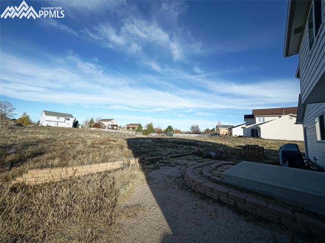 8572 Tibbs Road Peyton, CO 80831 - Photo 18 of 20 Another view of the large back yard.
